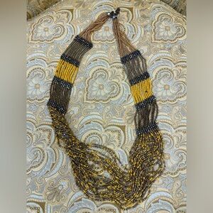 Long, layered beaded necklace